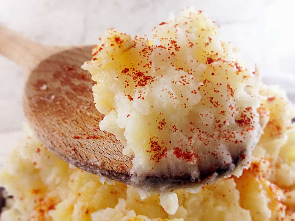 Mashed potatoes on a spoon.