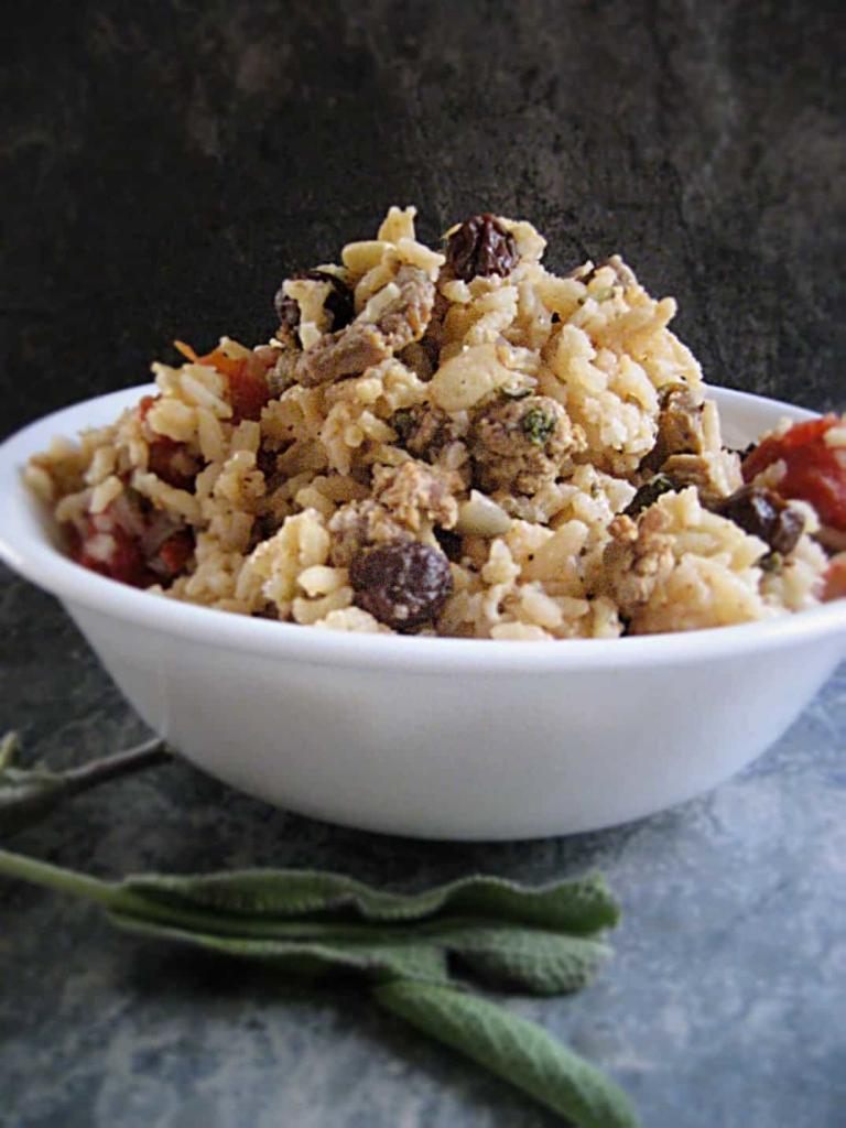 Savory Lamb Pilaf from the Balkans. Fresh sage, parsley, raisins and lamb come together to make this exotic rice dish from eastern Europe. Easy to make and super yum!