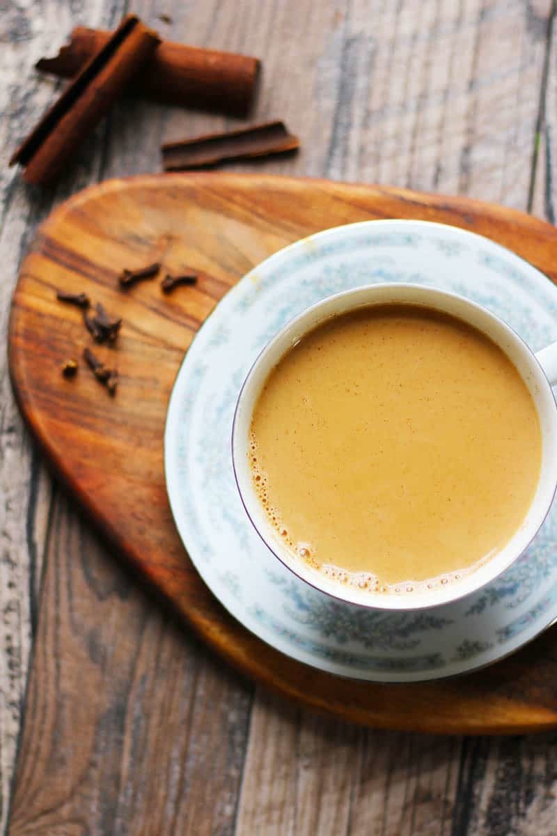 Indian Masala Chai Recipe. An authentic, Indian tea recipe flavored with cardamom, cinnamon, cloves, ginger and sugar. I lOVE making this!! It's a perfect cuppa anytime. | FusionCraftiness.com