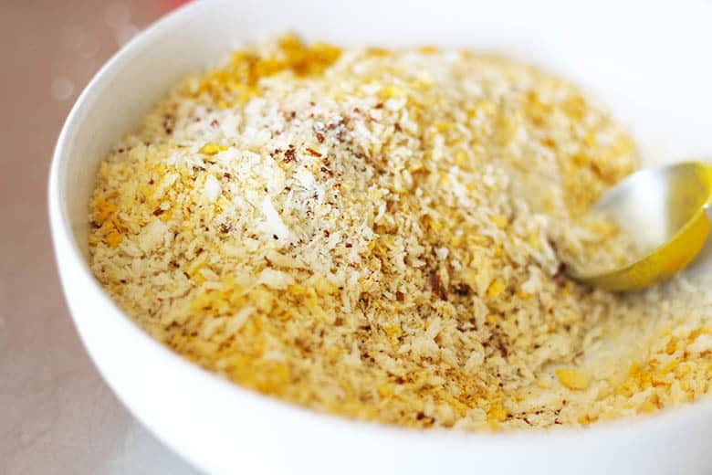 A bowl of panko bread crumbs mixed with Indian spices.