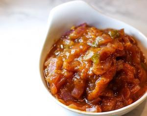 Apricot chutney in a white dish.
