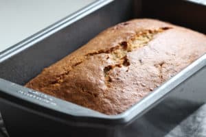 A banana bread in a loaf pan.