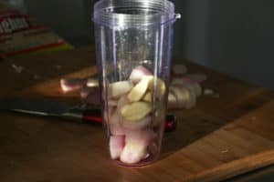 Garlic and shallots in a food processor.