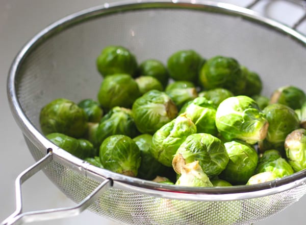 Brussels sprouts in a colander.