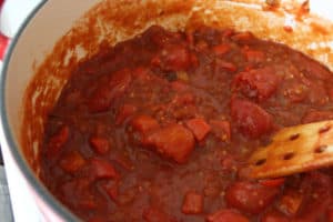 A pot with tomatoes stewing.