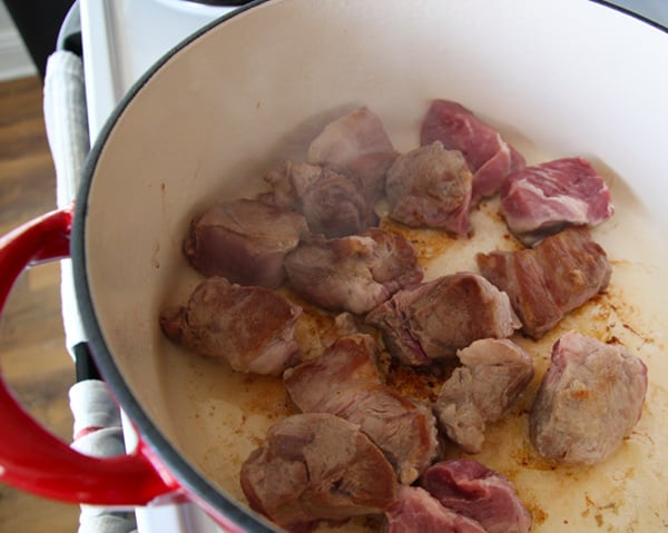 Meat browning in pot.