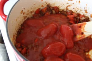 Canned tomatoes added too pot.