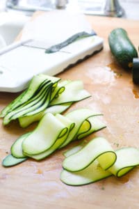 Thinly sliced zucchini with a mandolin.