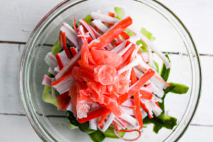 A bowl of Kani Salad ingredients.