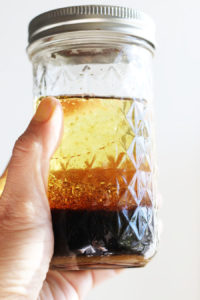 Asian sesame dressing ingredients in a jar before mixing.