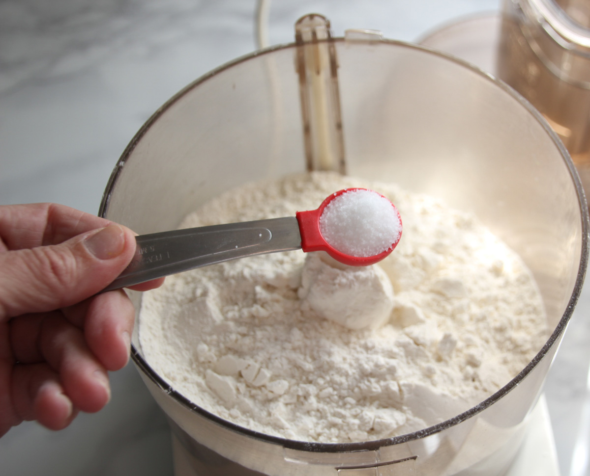 Salt added to flour in food processor.